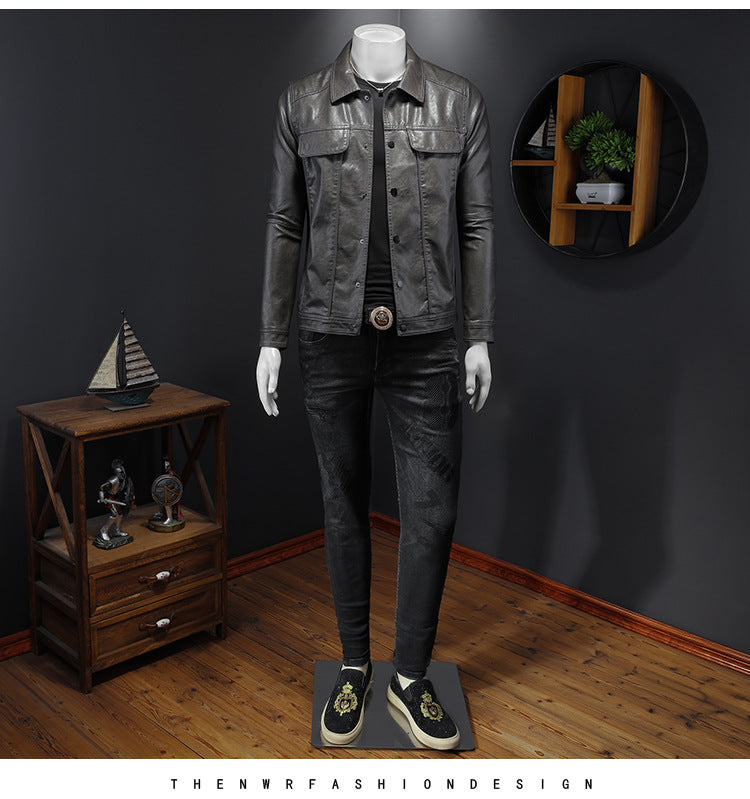 Man wearing a grey leather biker jacket in a casual streetwear outfit