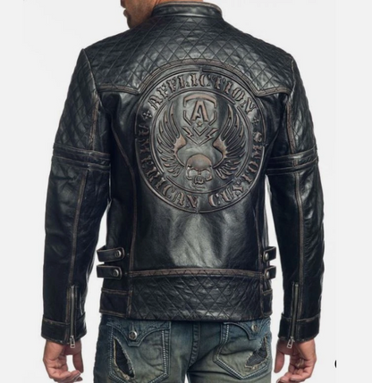 Close-up of embossed artwork across the back of a men's genuine leather biker jacket
