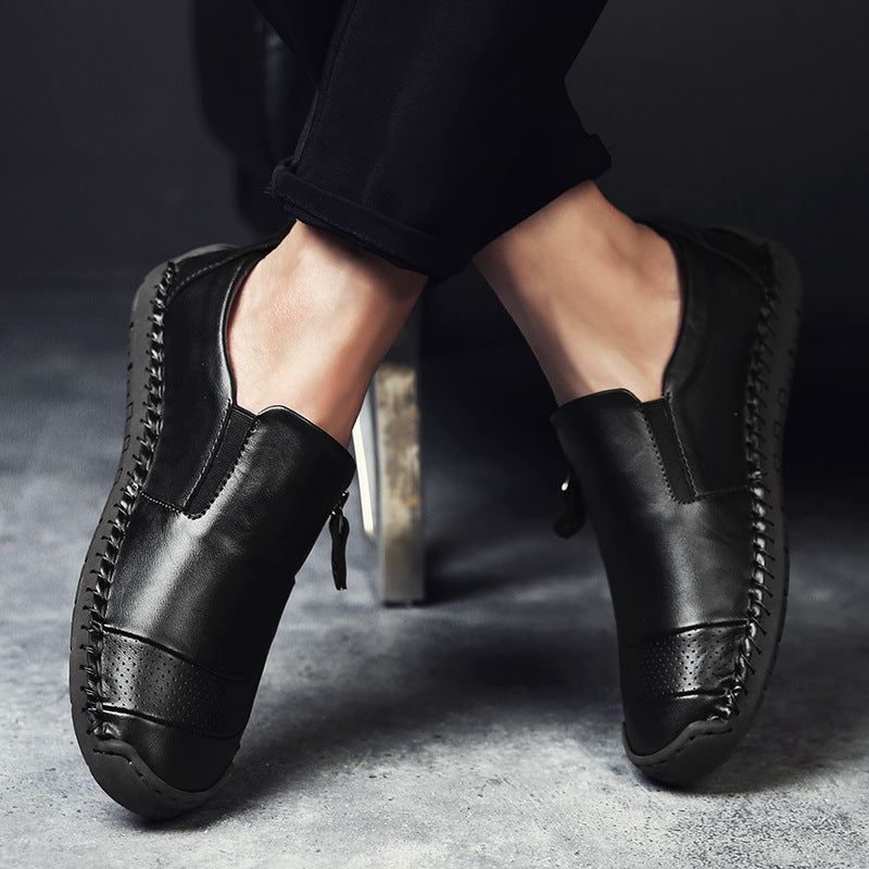 Man wearing leather-look slip-on flat shoes styled with chinos in a smart-casual setting