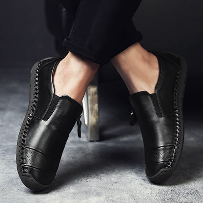 Man wearing leather-look slip-on flat shoes styled with chinos in a smart-casual setting