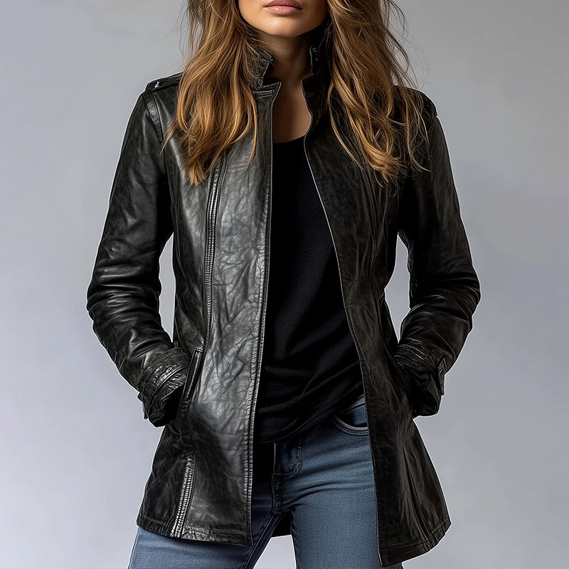 Woman layering an oversized black leather cardigan jacket over a dress, Al-Noor Bazaar